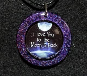 Matty’s Creations & Crystals – Win this “i Love You to The Moon and Back Holographic Glitter Pendant”.